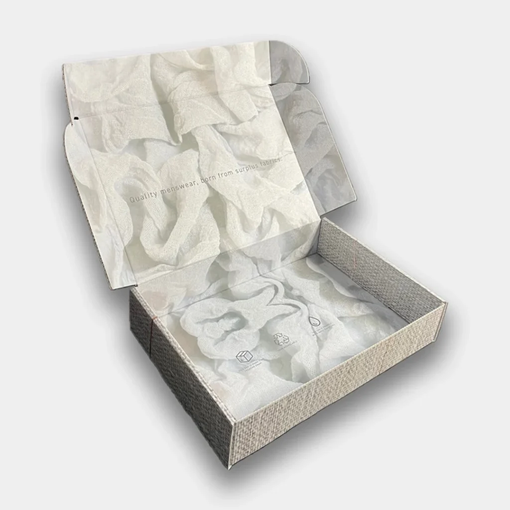 Open e-commerce box with a white fabric image