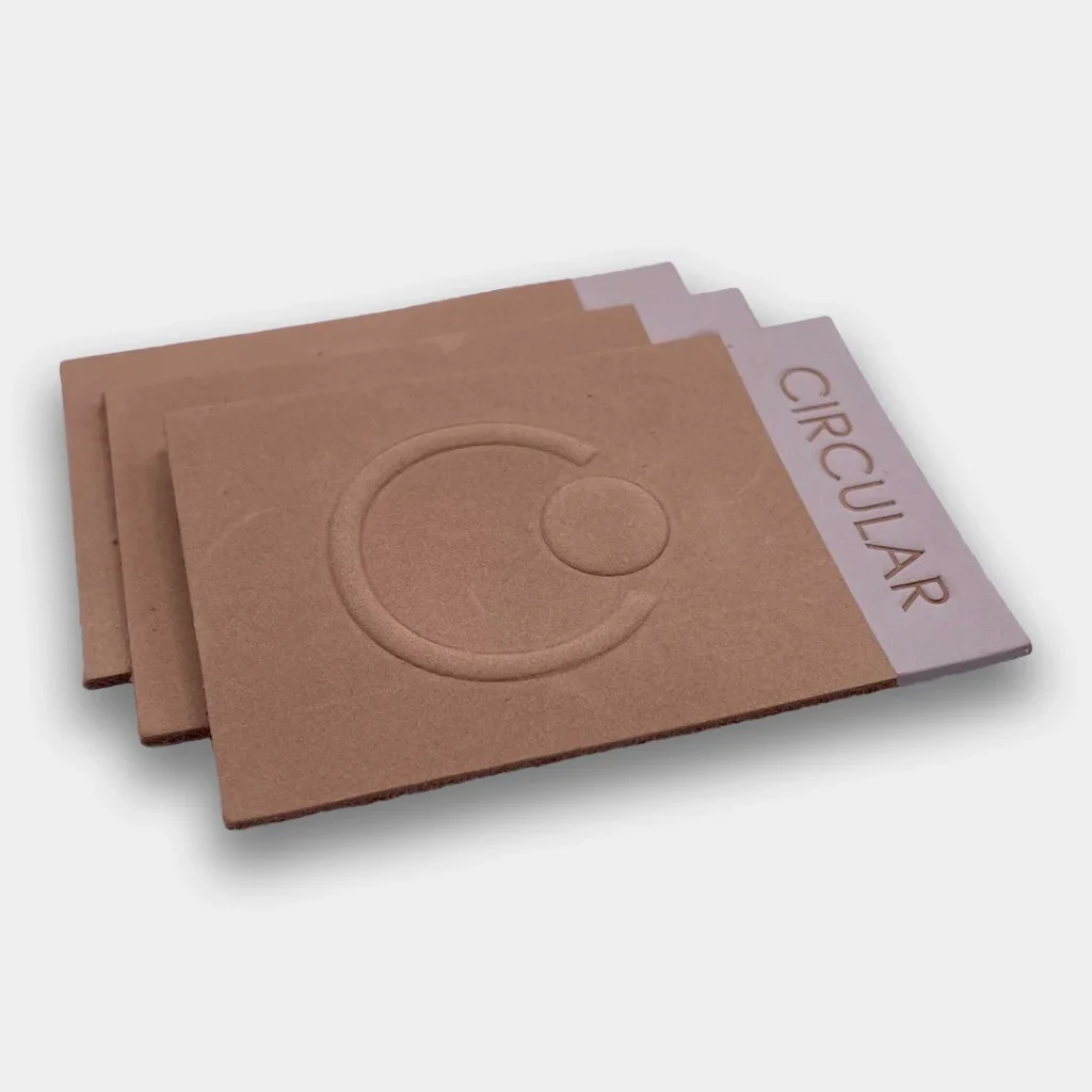 Tan rectangular leather patch with Circular logo