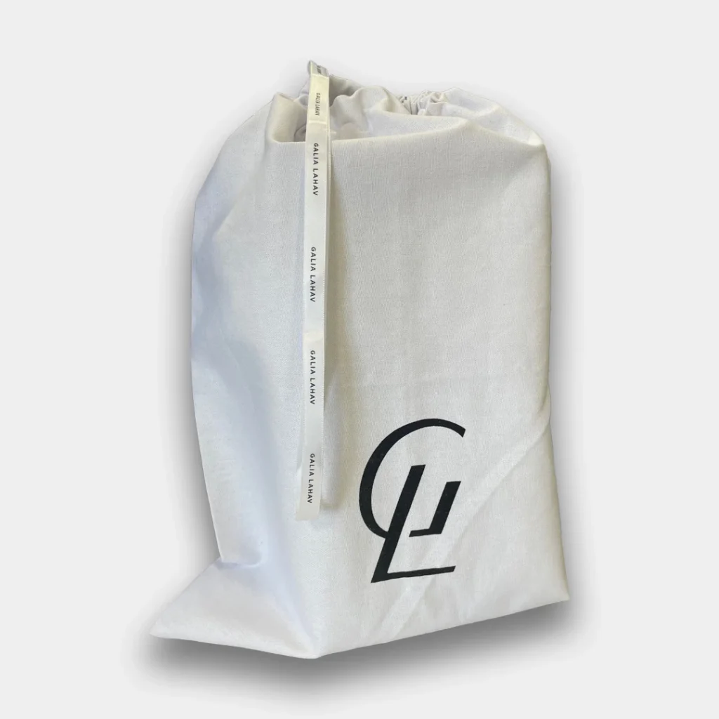 Cream dust bag with Galia Lahal logo