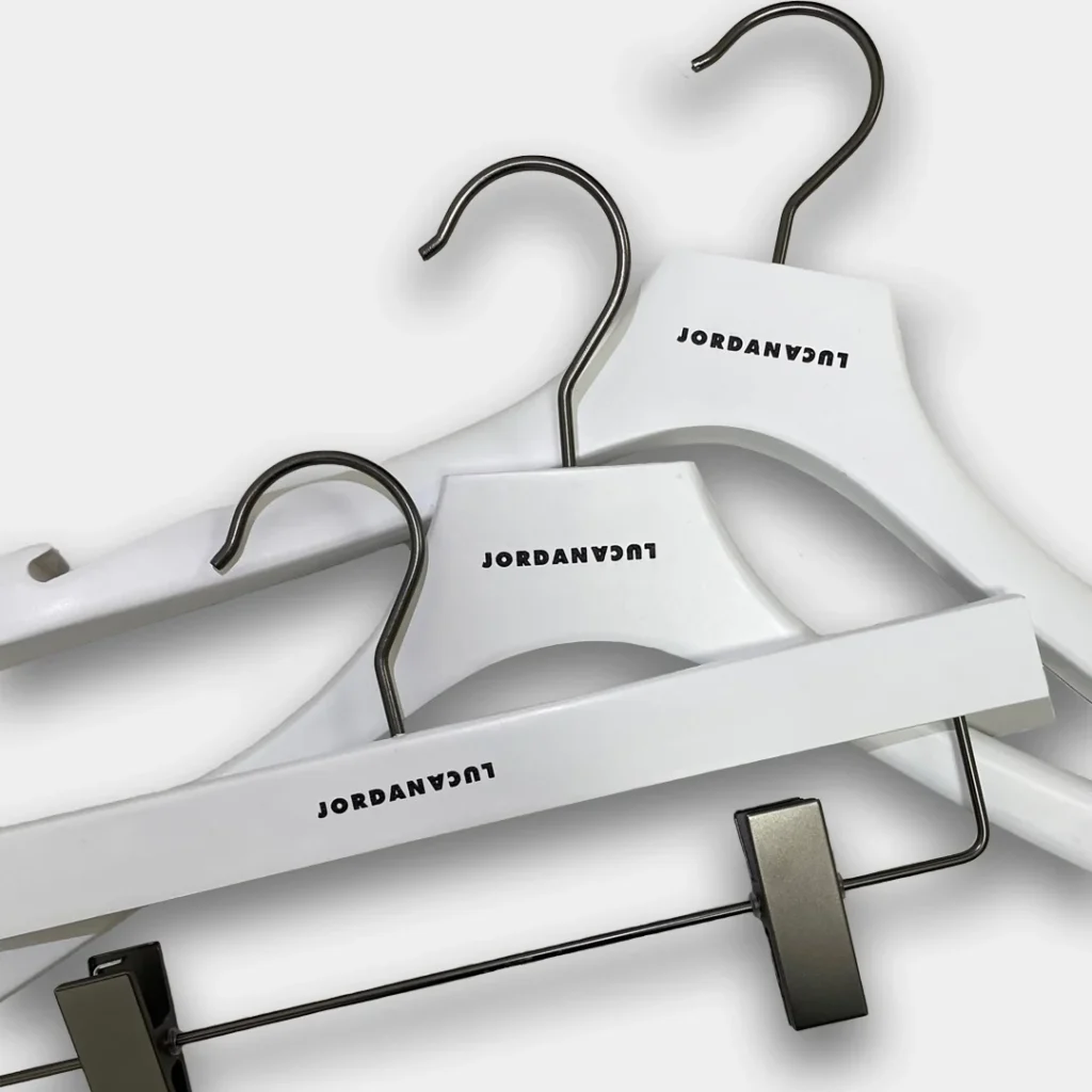 White hangers with Jordan Luca logo