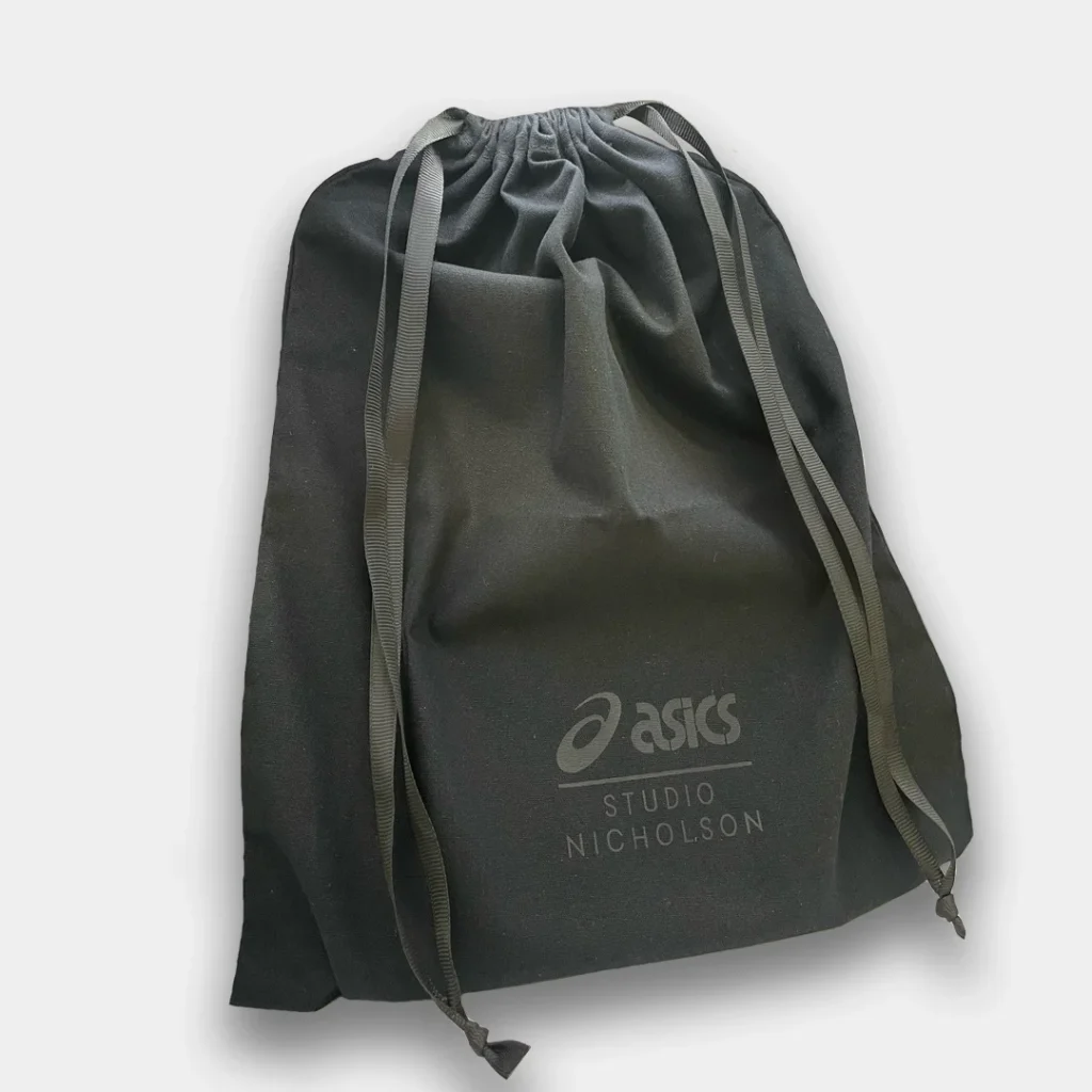 Dark grey dust bag with Asics logo